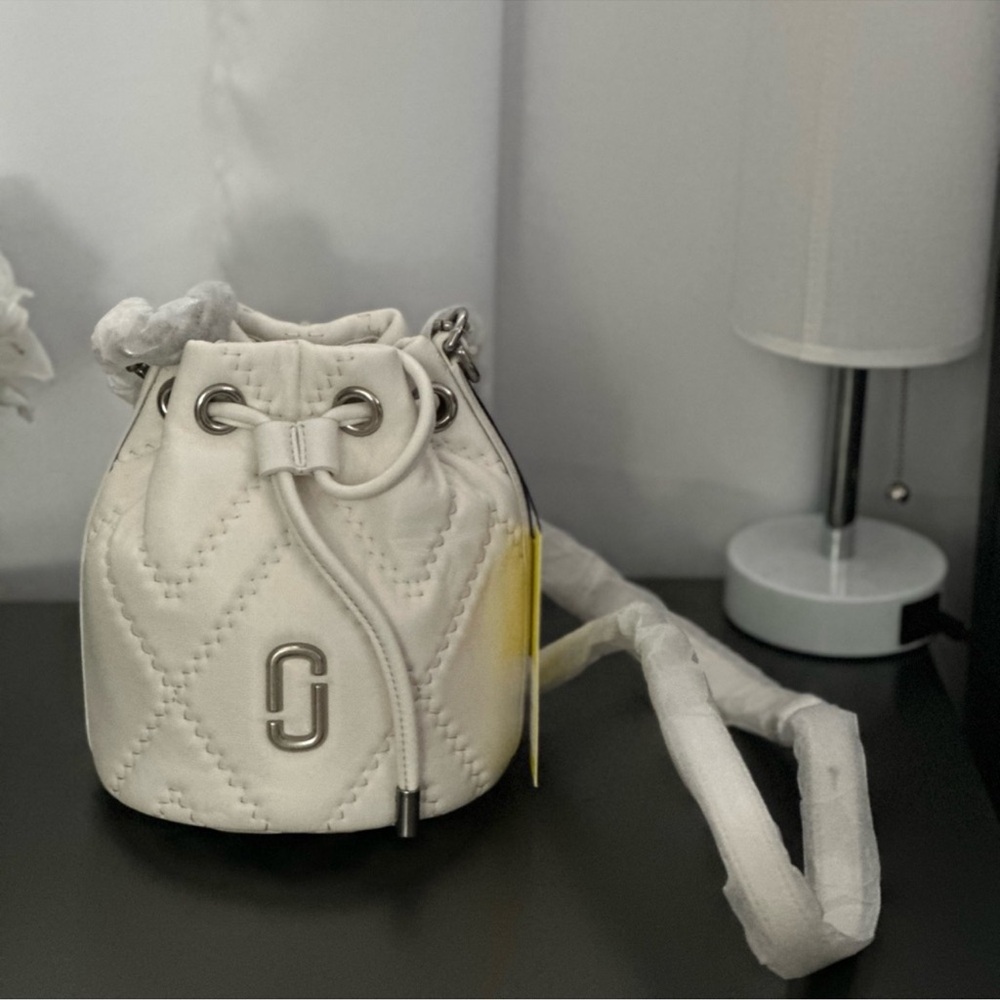 White Mini Bucket Bag with Drawstring Closure and Textured Material